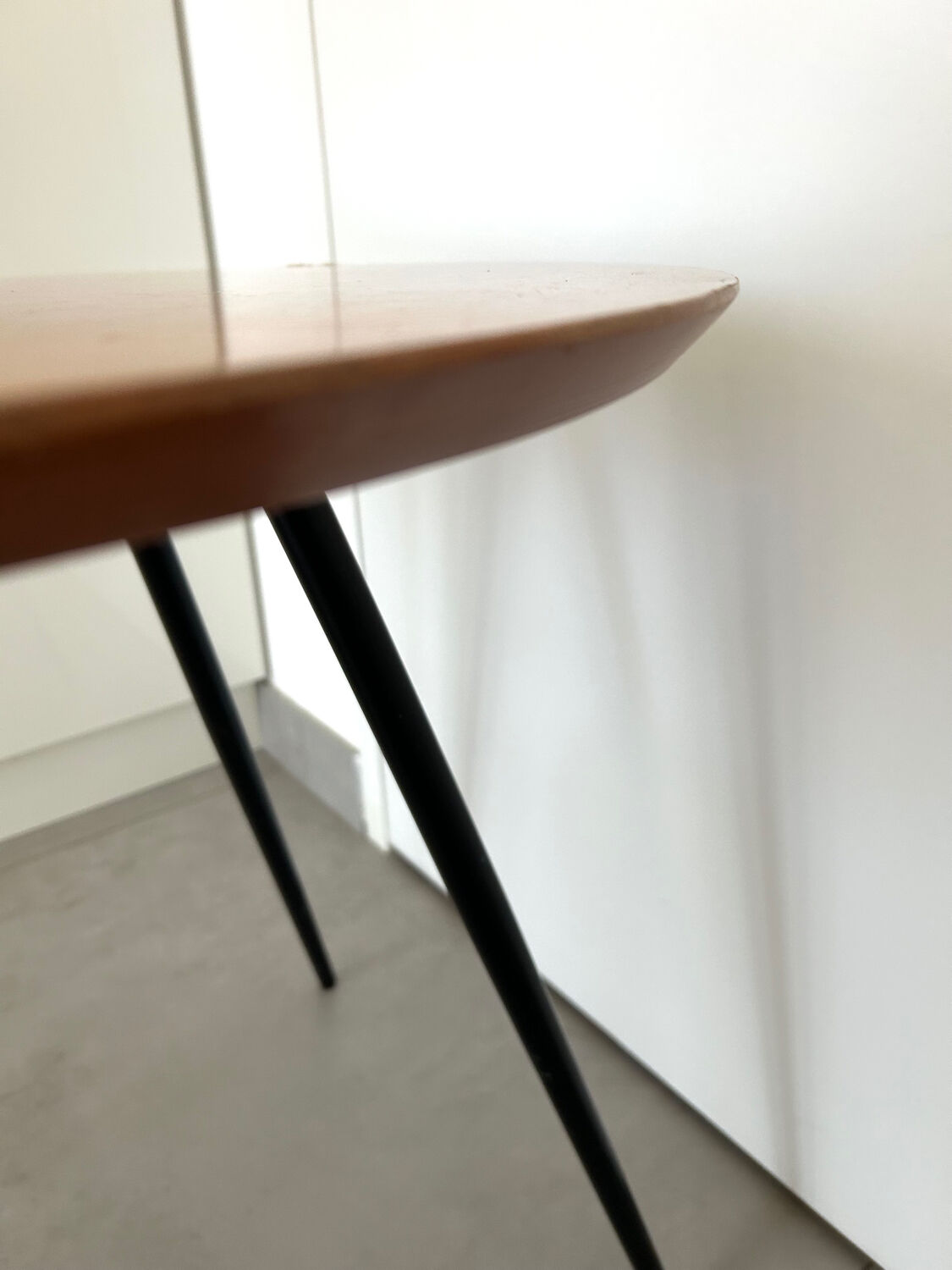 1970s coffee table in honey beech with black steel legs.