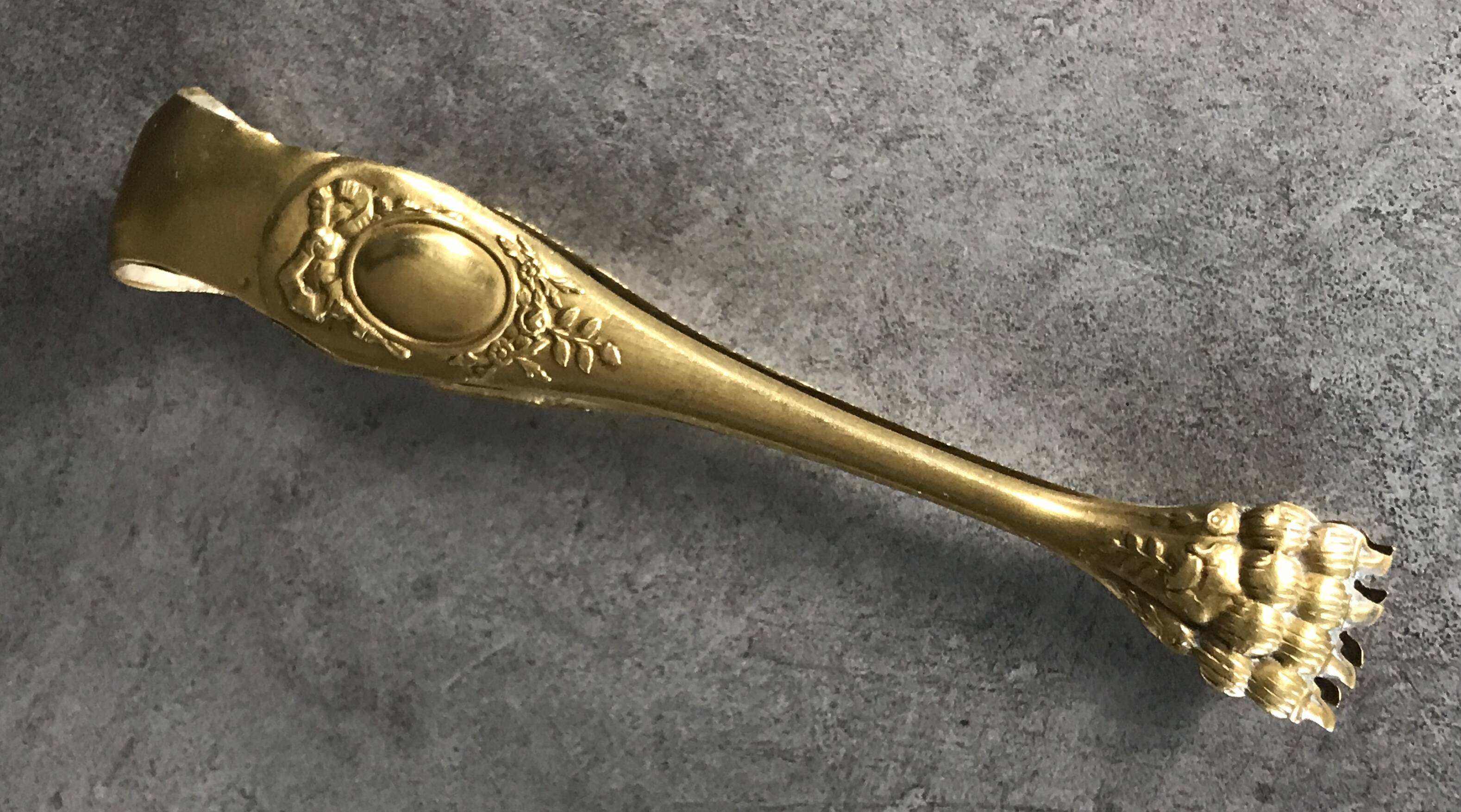 Sugar or ice cube tongs, gold star stamp with lion paw finish
