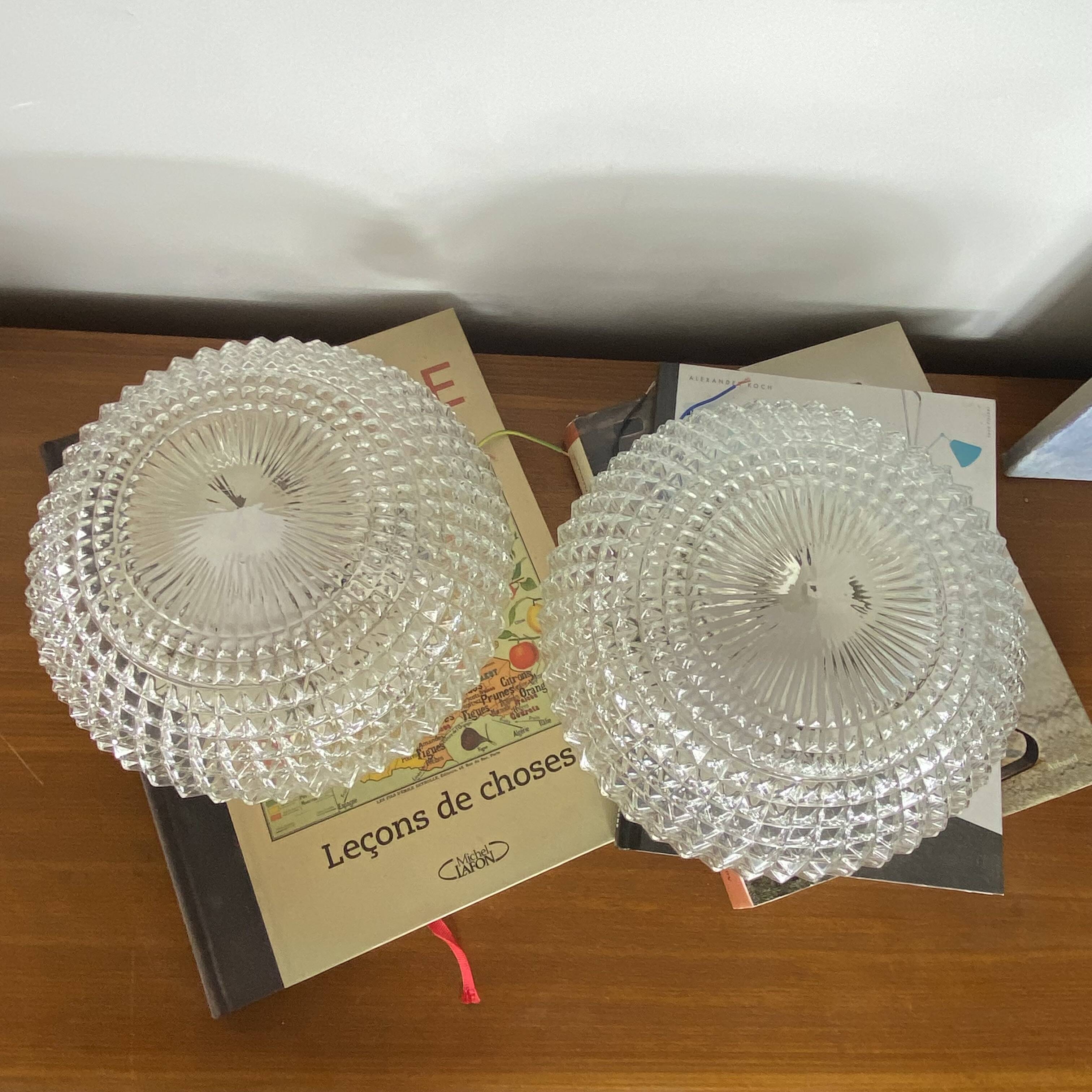 Large pair of round wall sconces ceiling lights in transparent glass.
