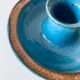 Blue enamelled sandstone candlestick