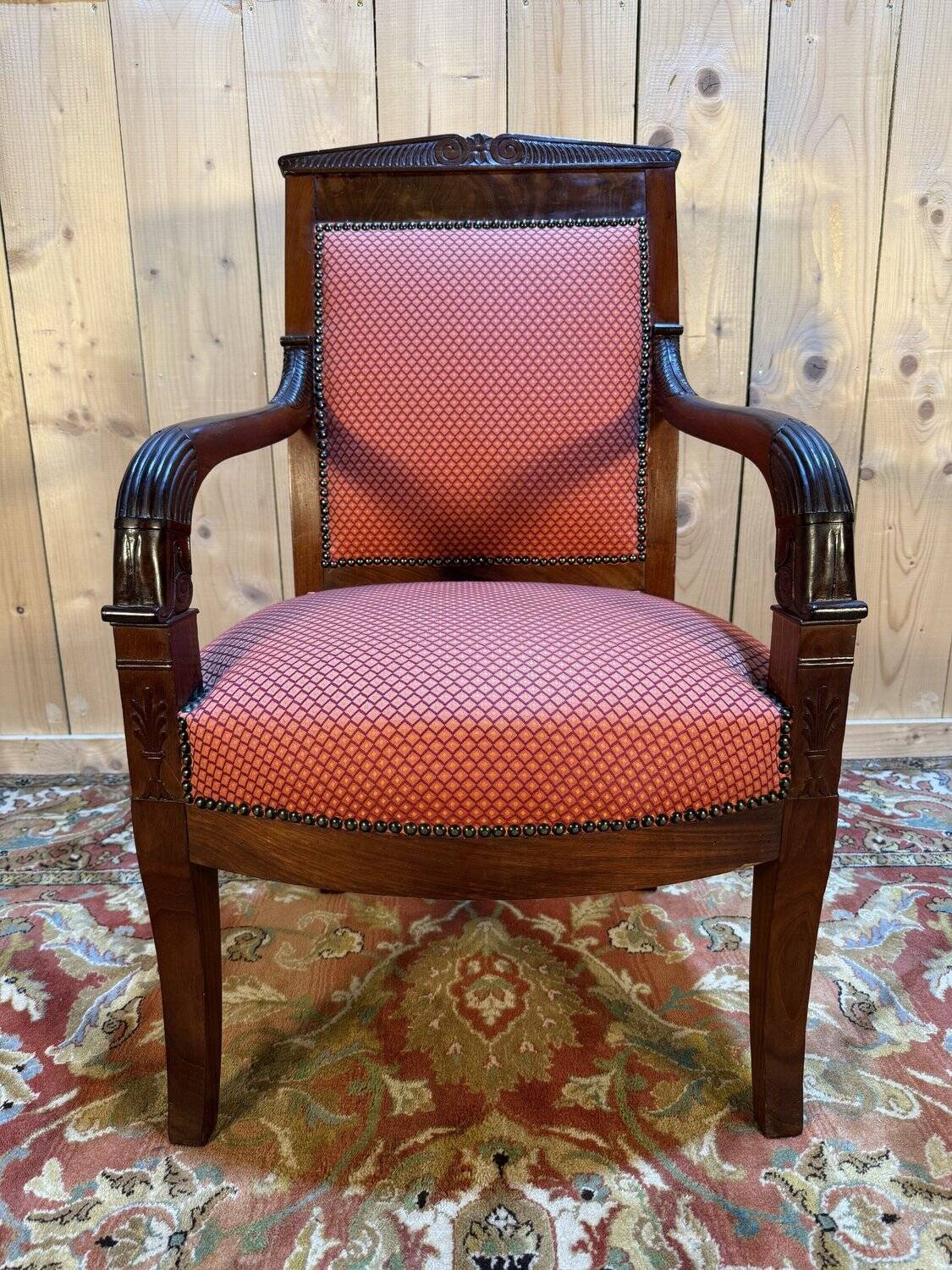 Empire period armchair in mahogany with saber legs.