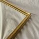Antique Deknudt mirror in golden resin - 70 x 34 cm