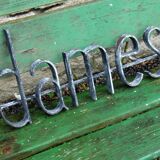 Former hairdresser sign "dames" in metal