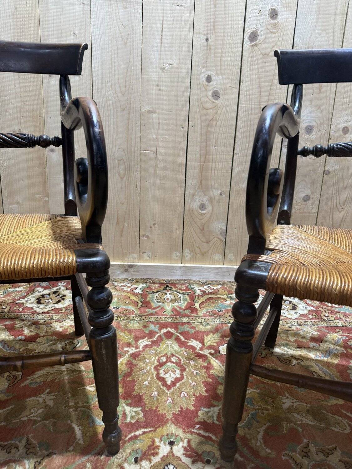 Pair of rustic straw-seated armchairs