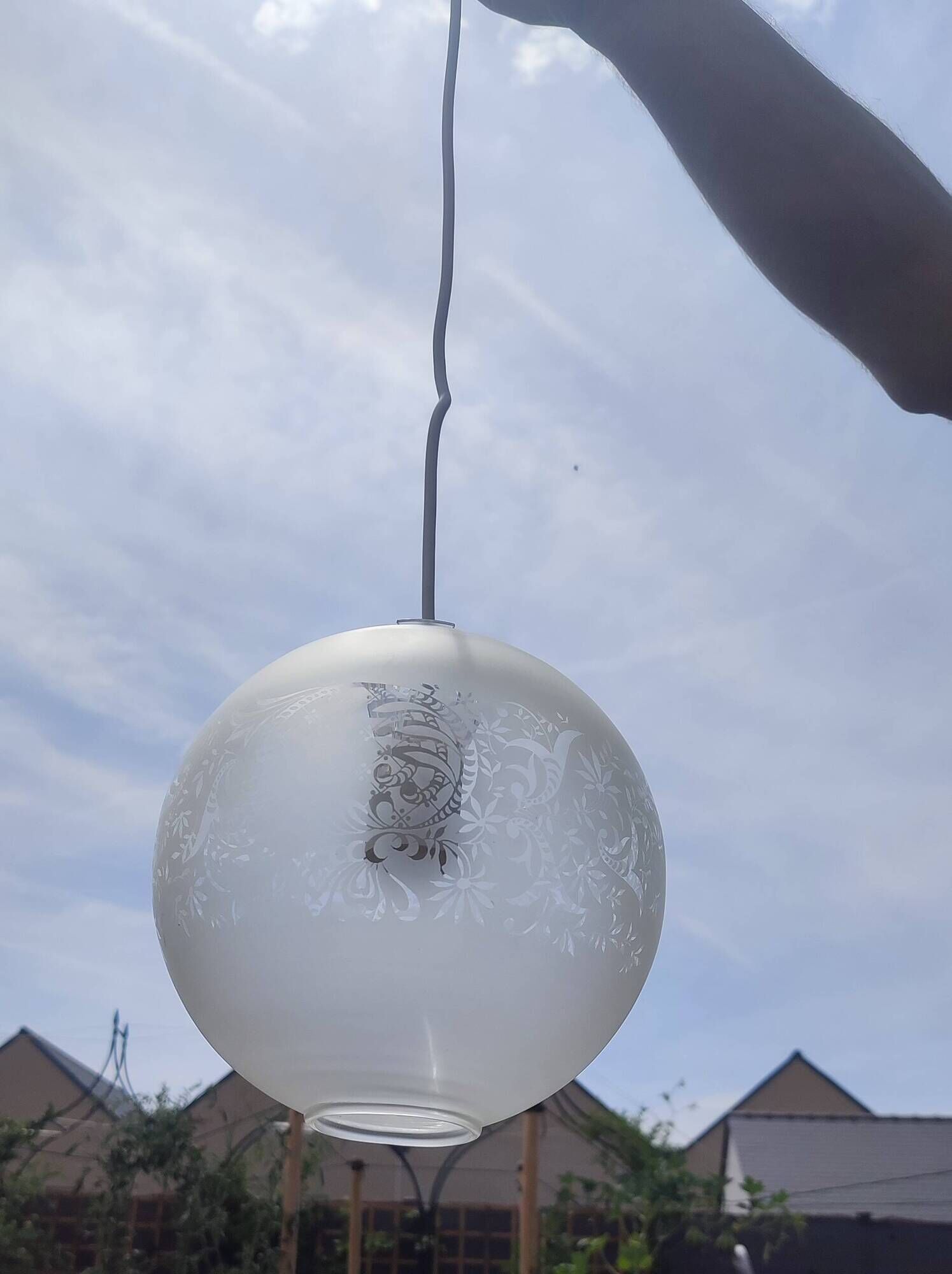 Frosted glass suspension globe with floral patterns in Art Deco style.