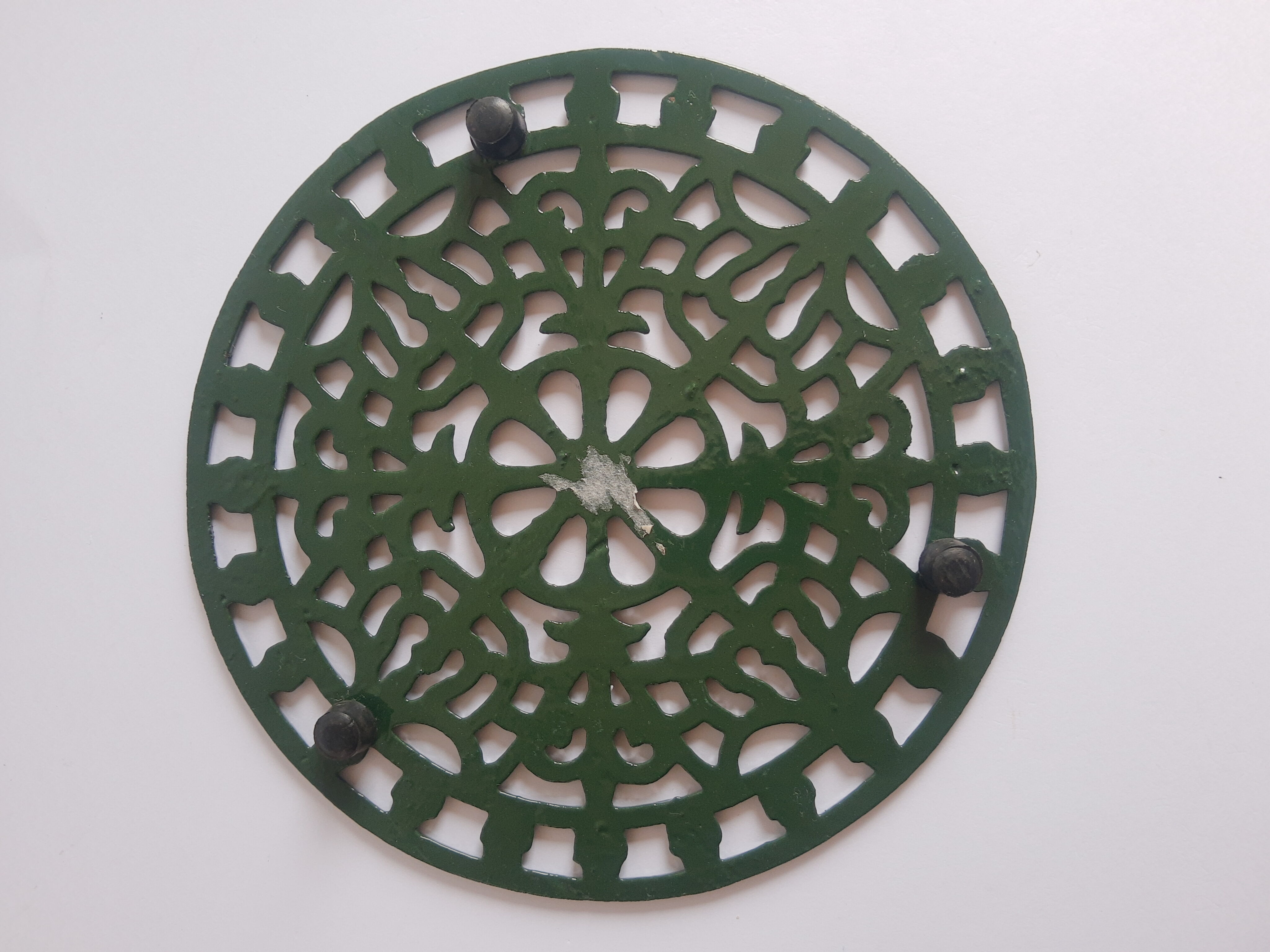 Vintage green cast iron trivet