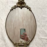 Antique oval brass crest mirror, 41x26 cm