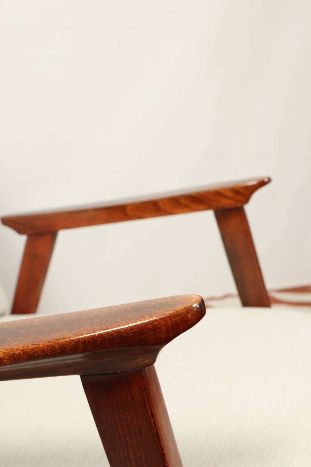 Vintage light gray armchair dark wood Scandinavian design 1970