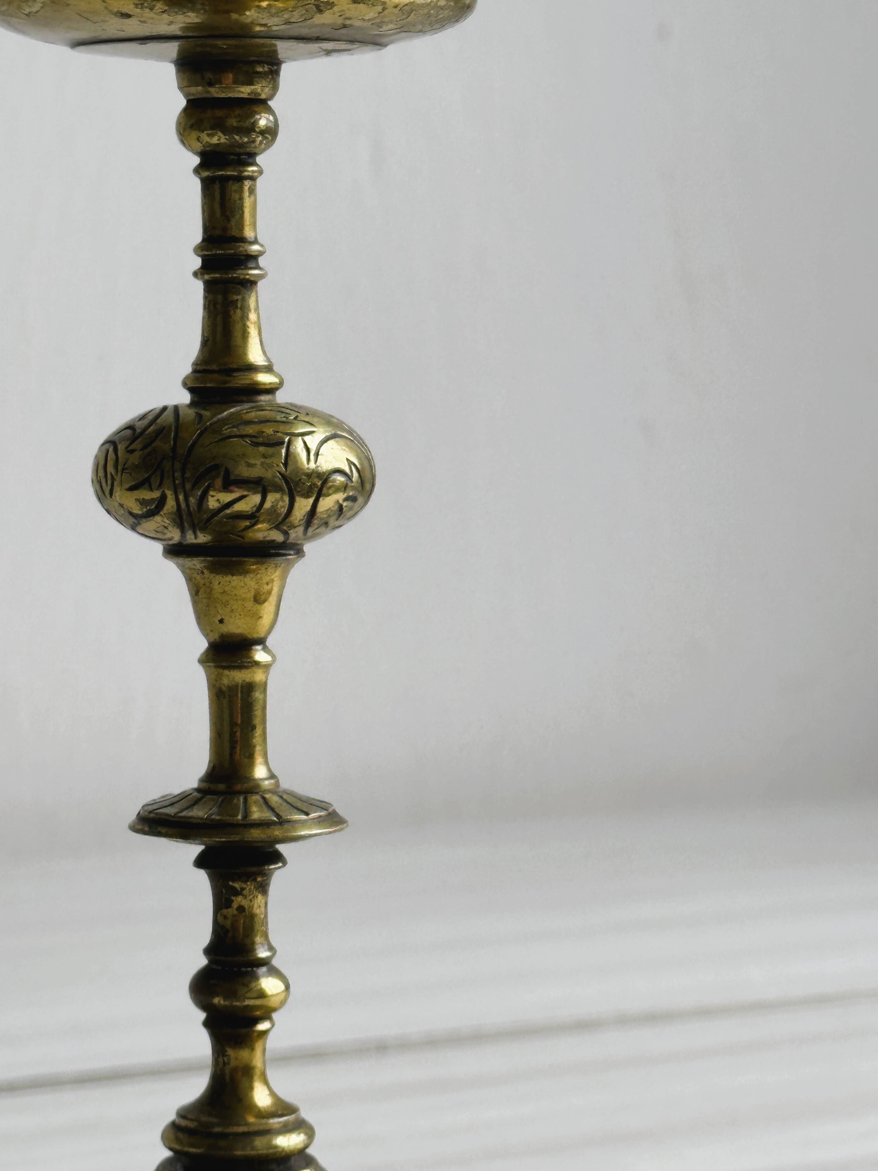 Carved brass candlestick holder