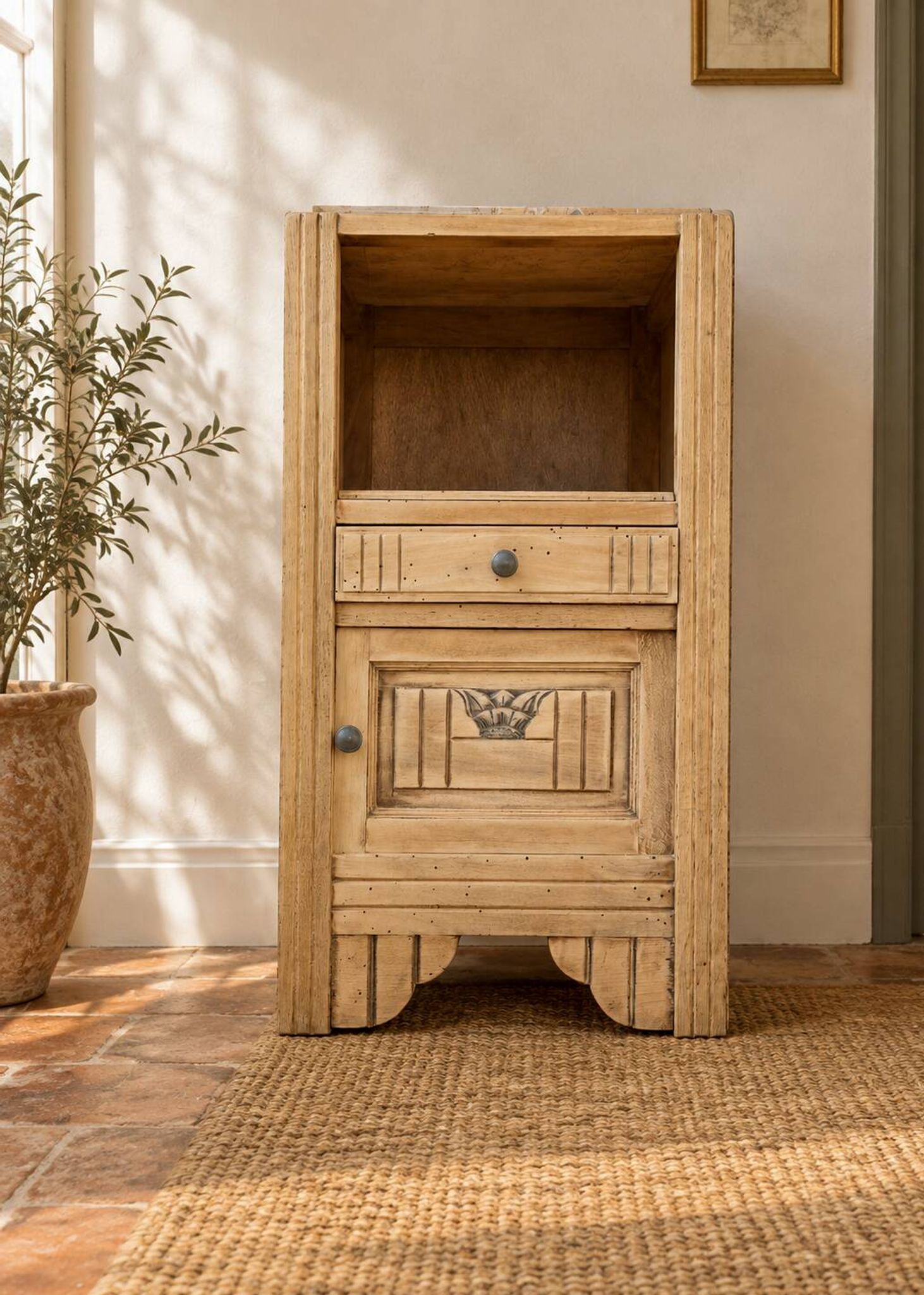 Small Art Deco bedside table in light wood with a terrazzo effect top.