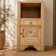 Small Art Deco bedside table in light wood with a terrazzo effect top.