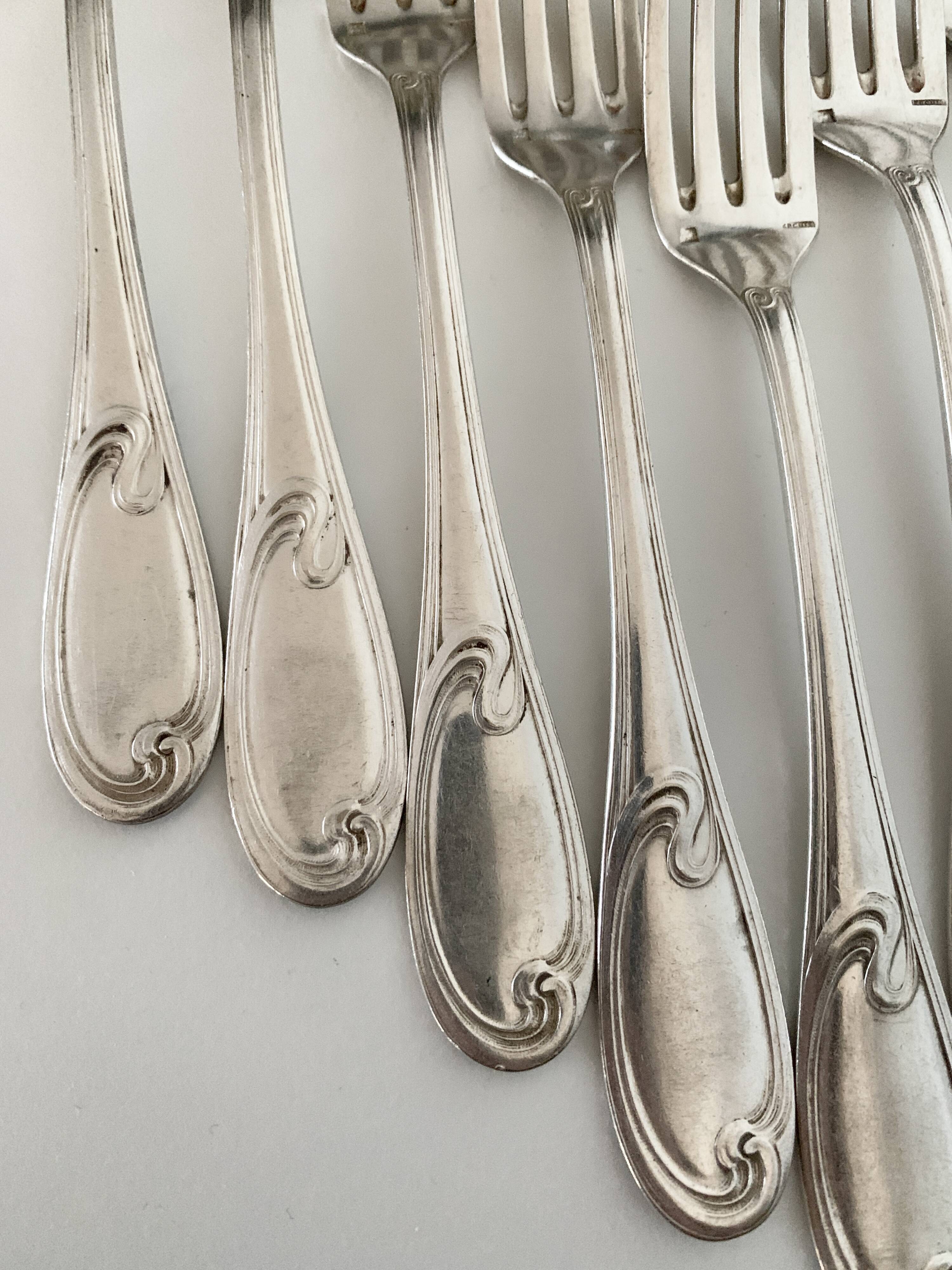 Nine large Ercuis silver-plated forks