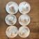 6 antique cups and mismatched saucers