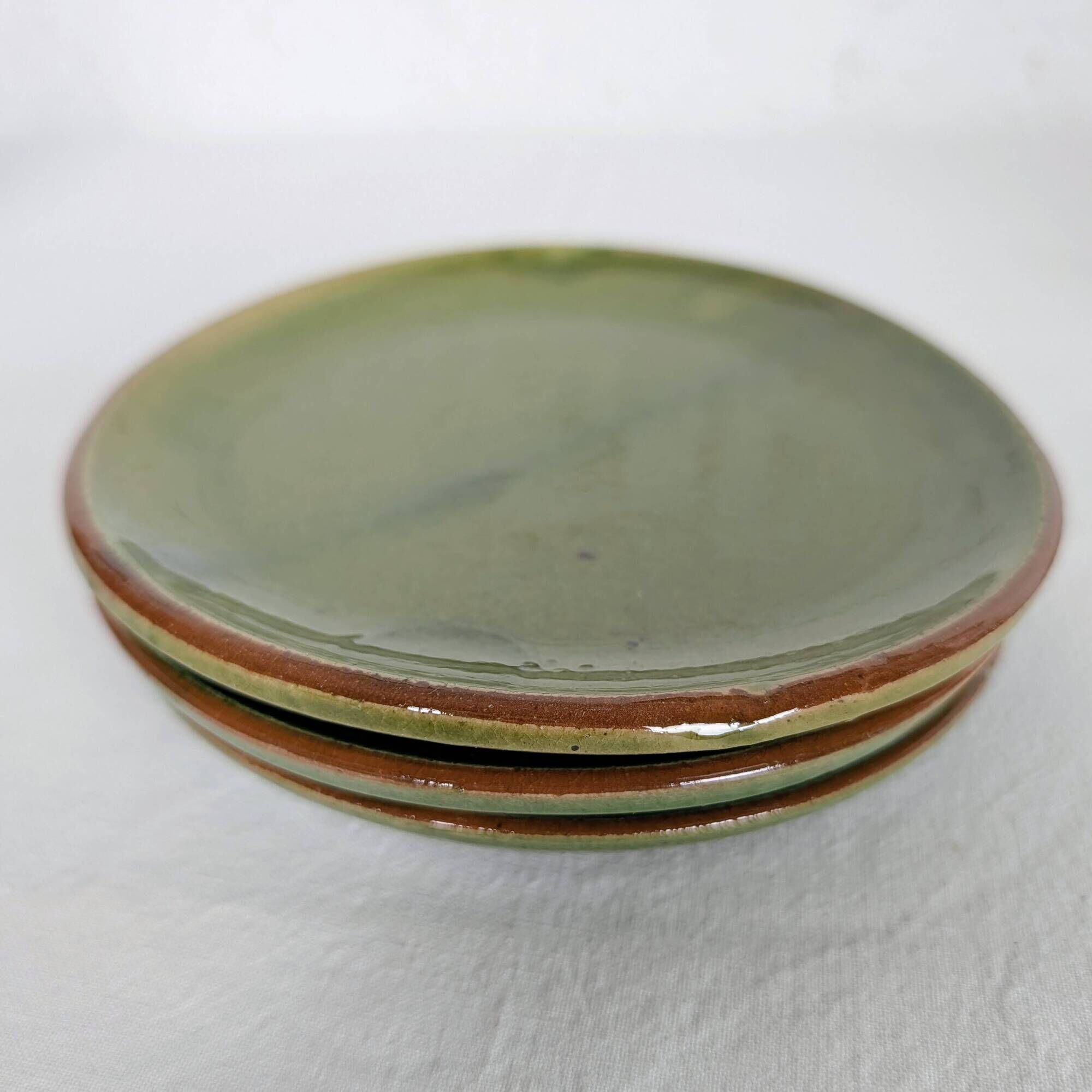 Small plate in glazed green earthenware
