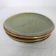Small plate in glazed green earthenware