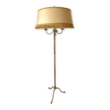 Three-light tripod floor lamp in gilded brass.