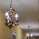 Set of 3 gold painted metal chandeliers