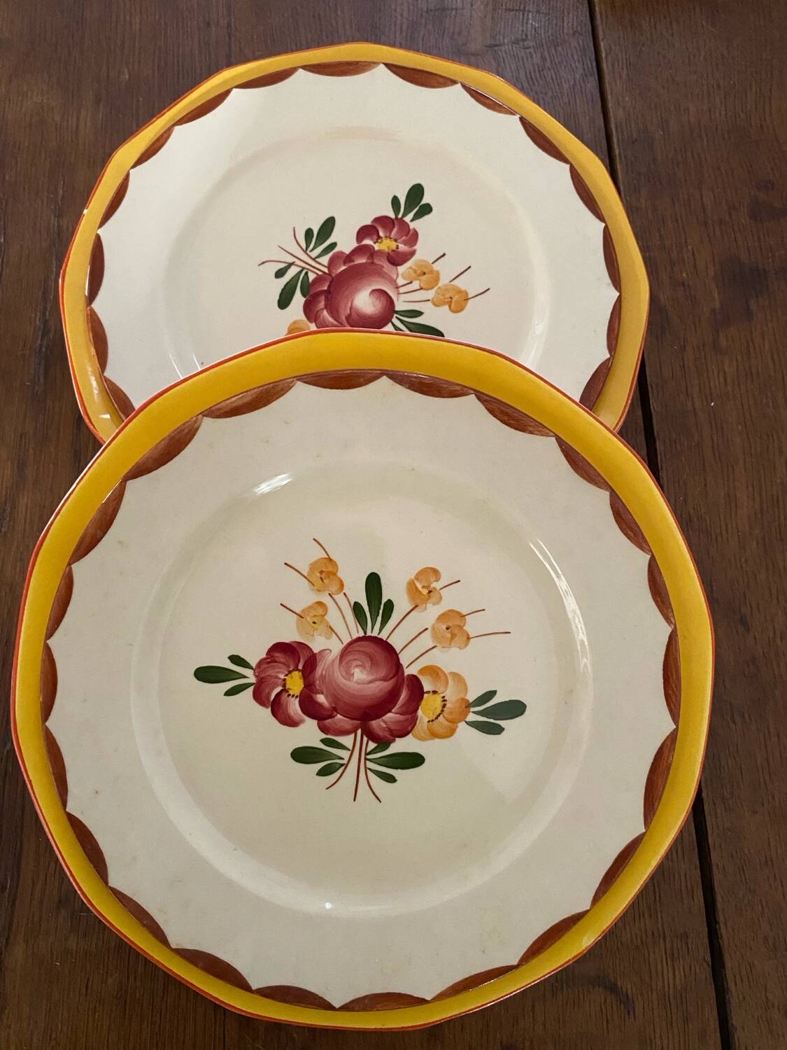 Flowered stamped dessert plates and matching ones.