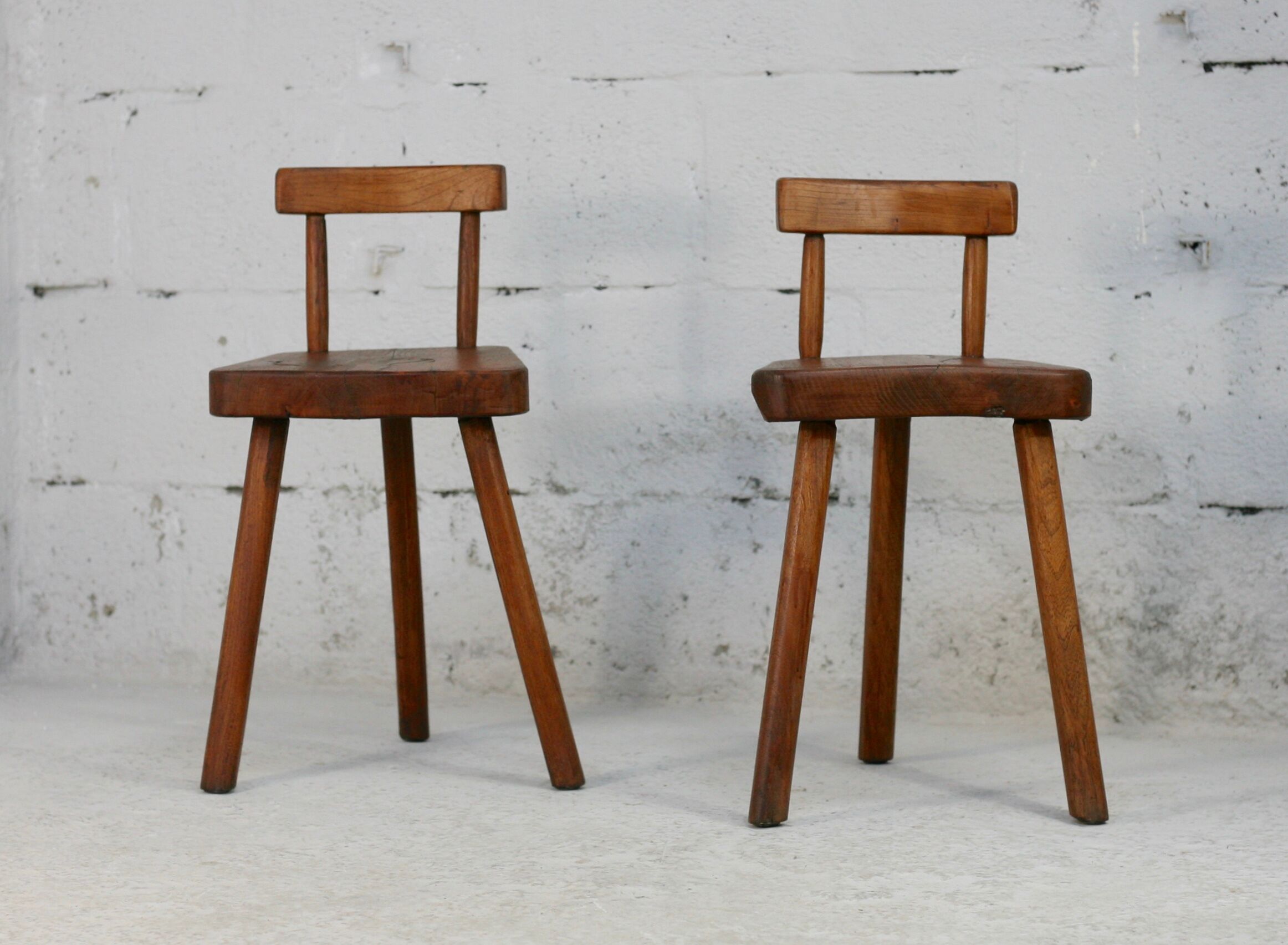 Pair of tripod stools with brutalist backrests, France, circa 1960