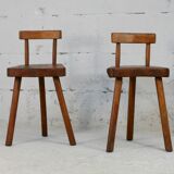 Pair of tripod stools with brutalist backrests, France, circa 1960