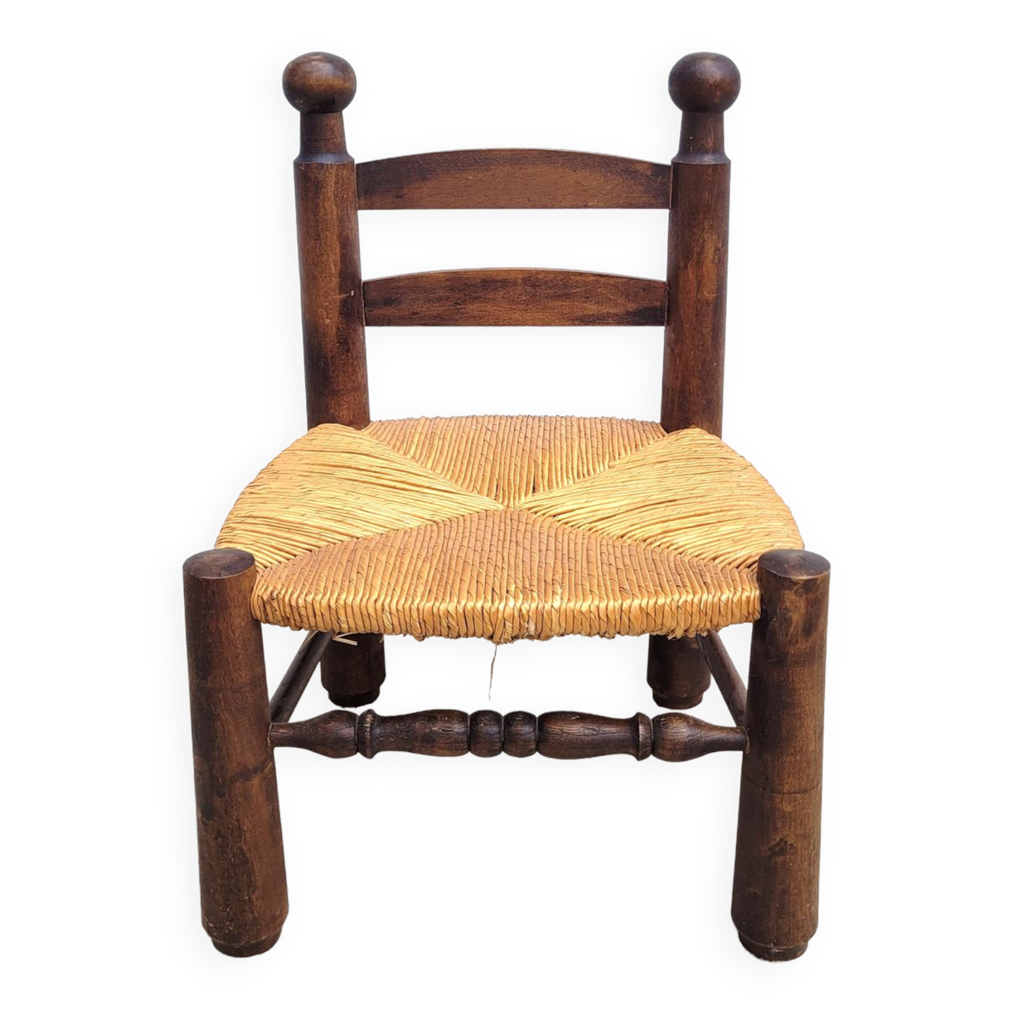 Low chair in turned wood and straw