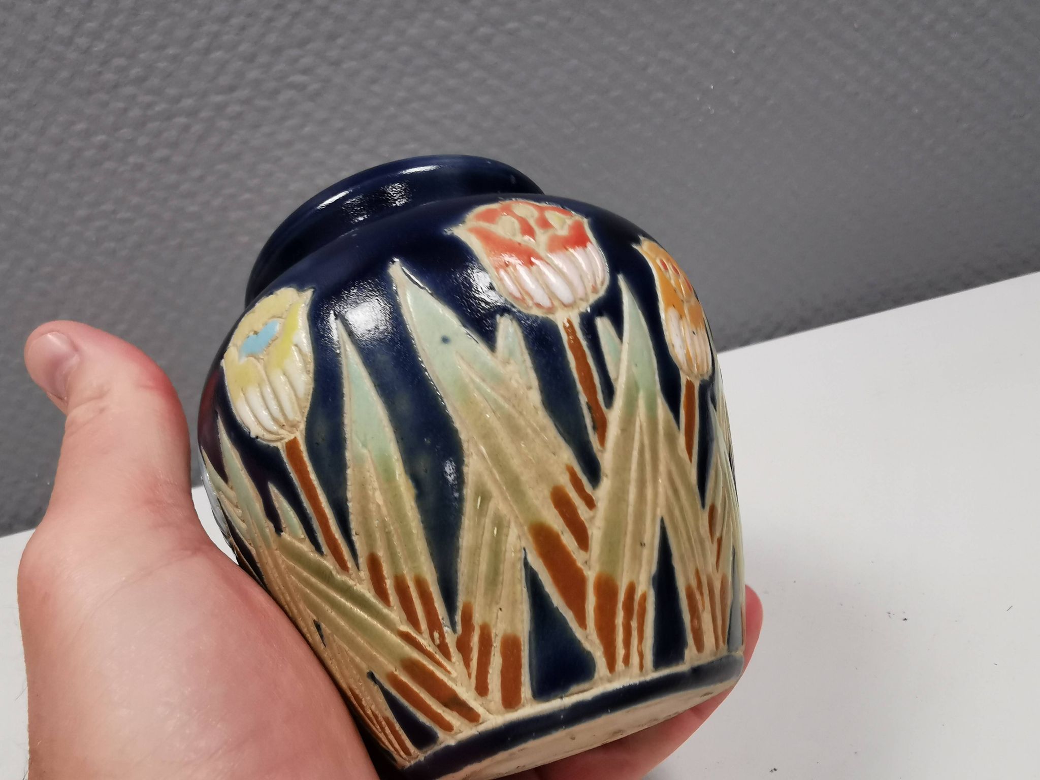Small delicious blue ceramic vase with floral decoration. Sweden 1970s
