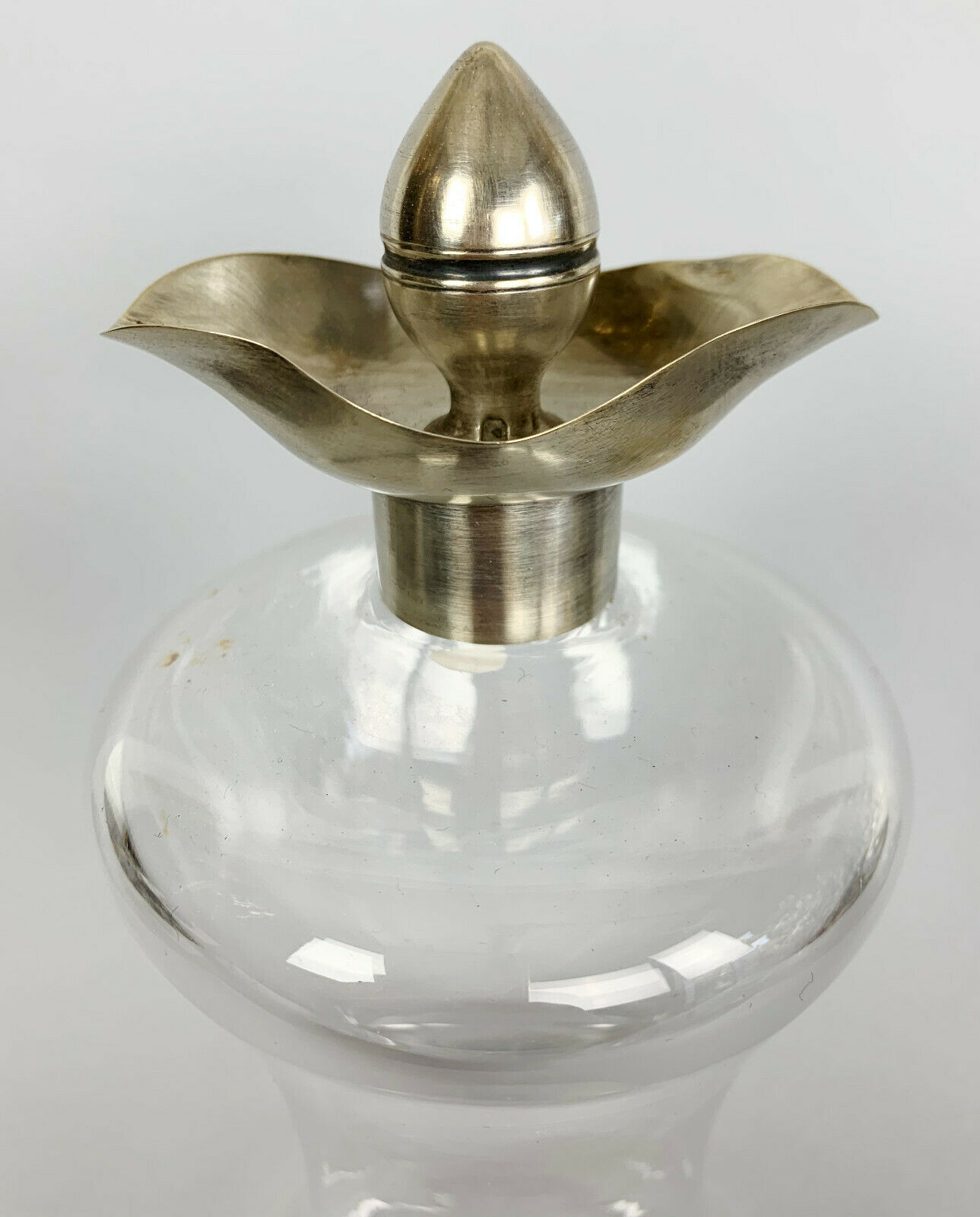 Blown glass carafe with silver frame and cap