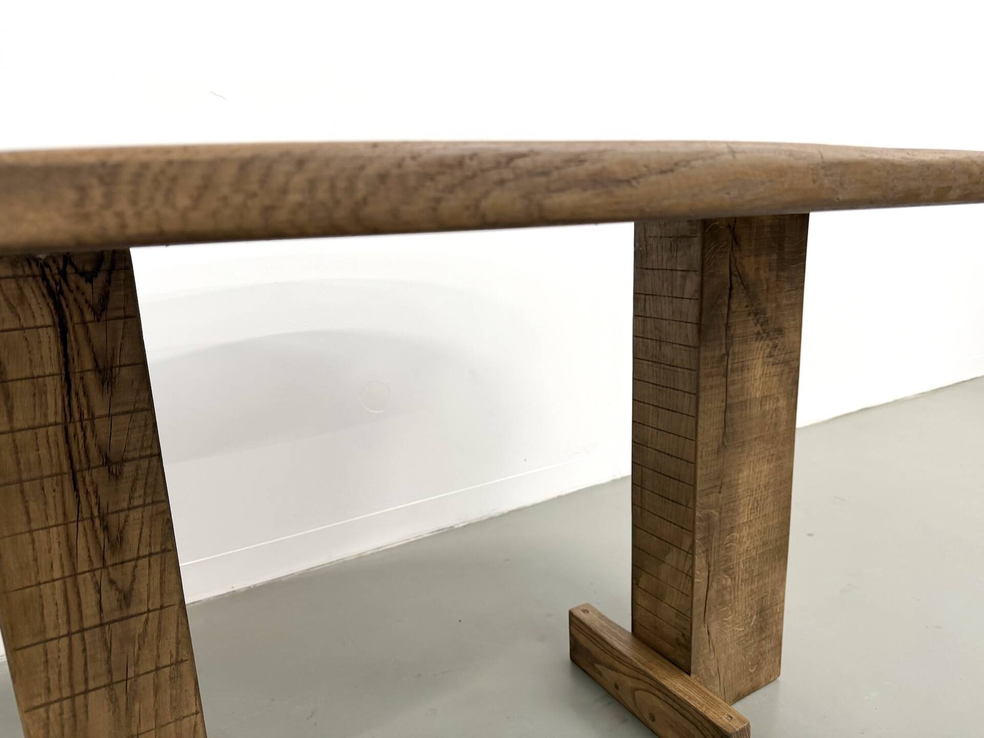 Oval table with T-shaped legs, solid oak, student woodworking project.