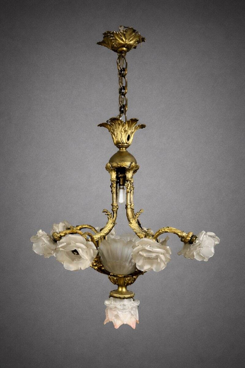 Rare and important gilded bronze chandelier with shells and roses.