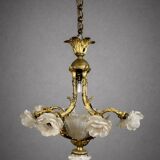 Rare and important gilded bronze chandelier with shells and roses.