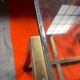 Geometrical regency coffee table in patinated brass, 1970s