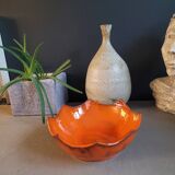 Orange ceramic star-shaped empty bowl