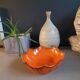 Orange ceramic star-shaped empty bowl