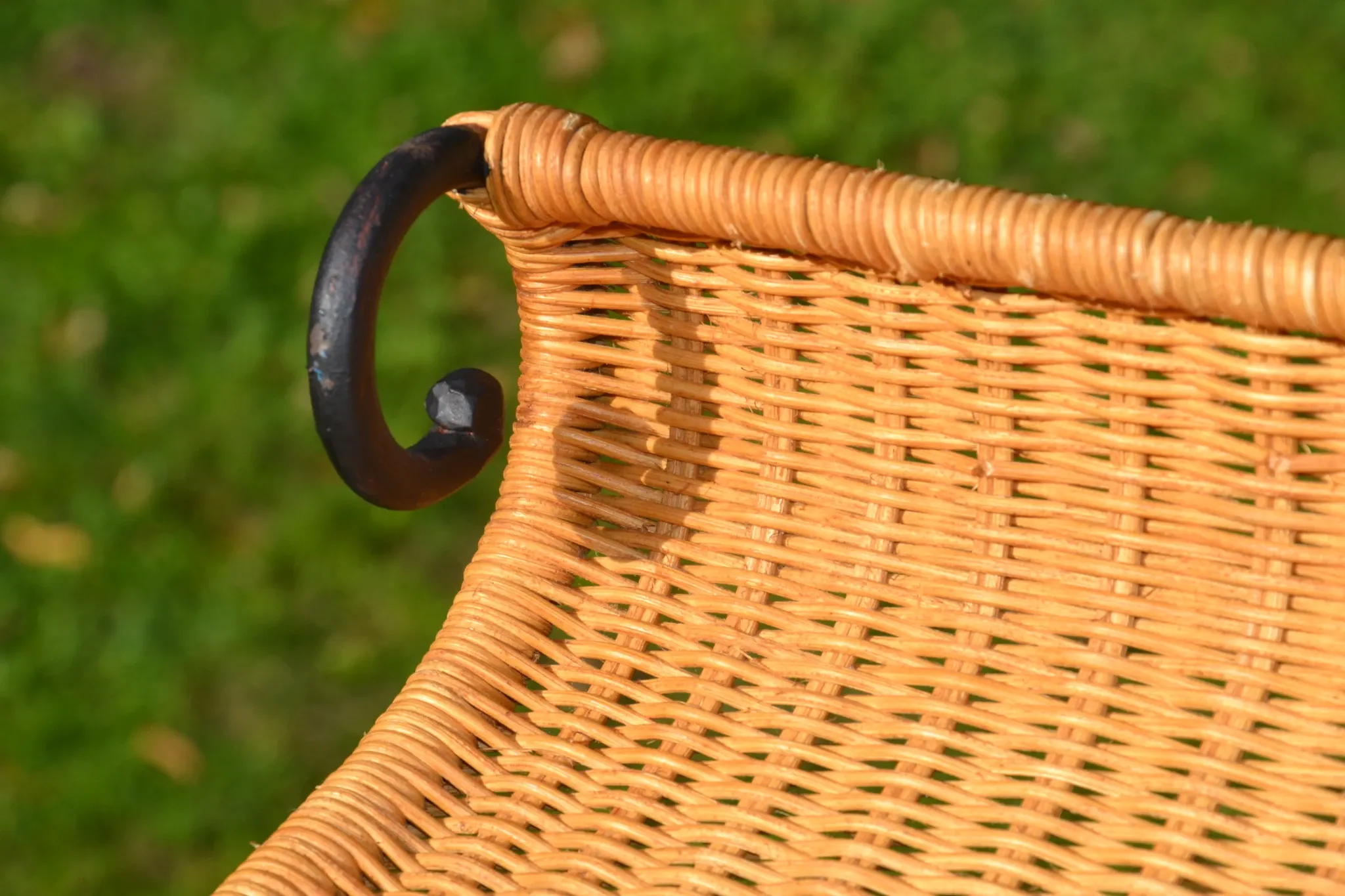 Wrought iron and rattan magazine/newspaper rack