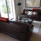 Two brown leather Crozatier two-and-a-half-seater sofas.
