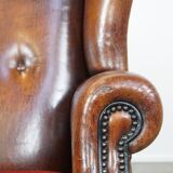 Set of 2 sheep leather wingback chairs with red corduroy seat cushions