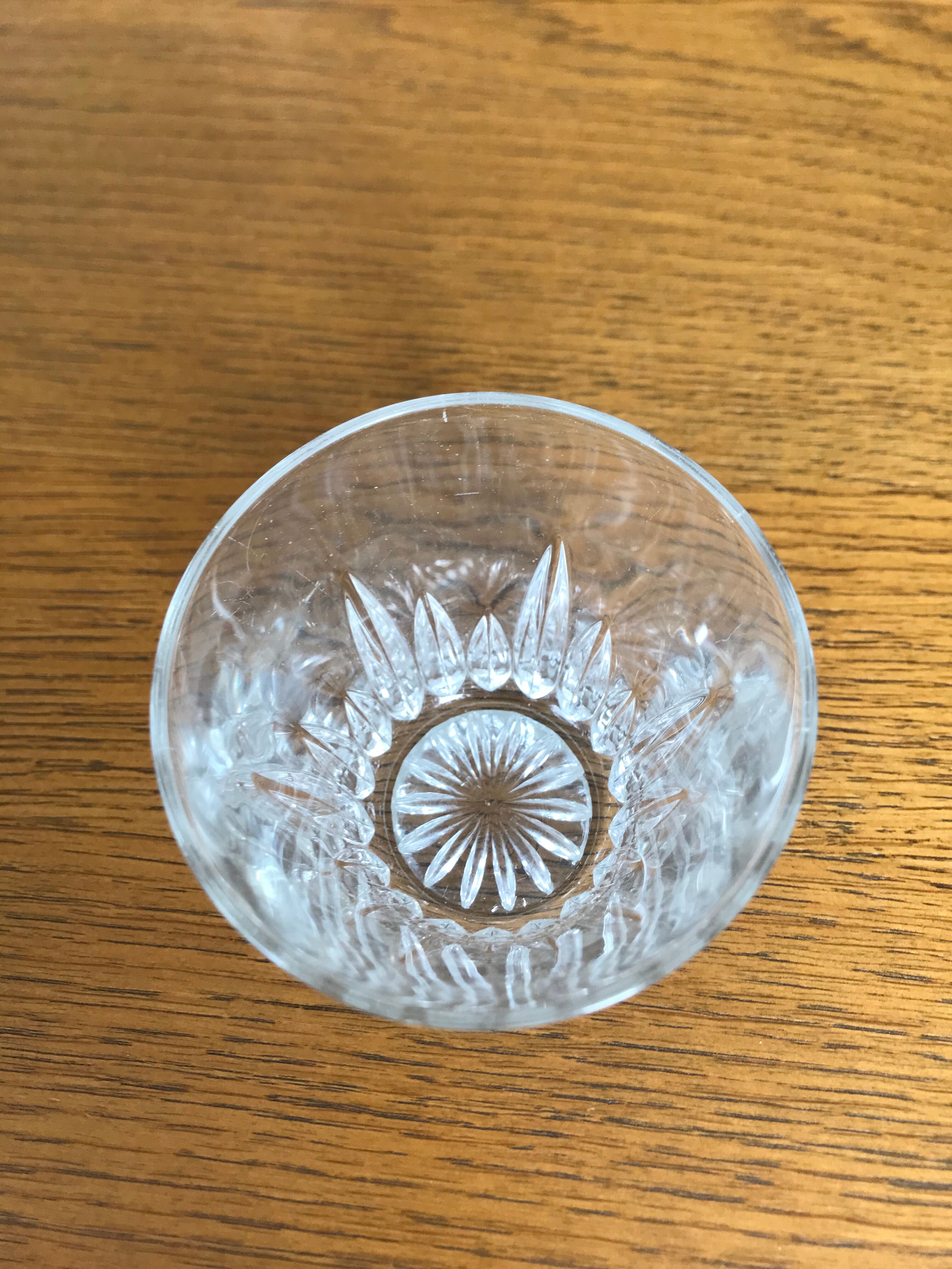 Mismatched decanter and whiskey glasses