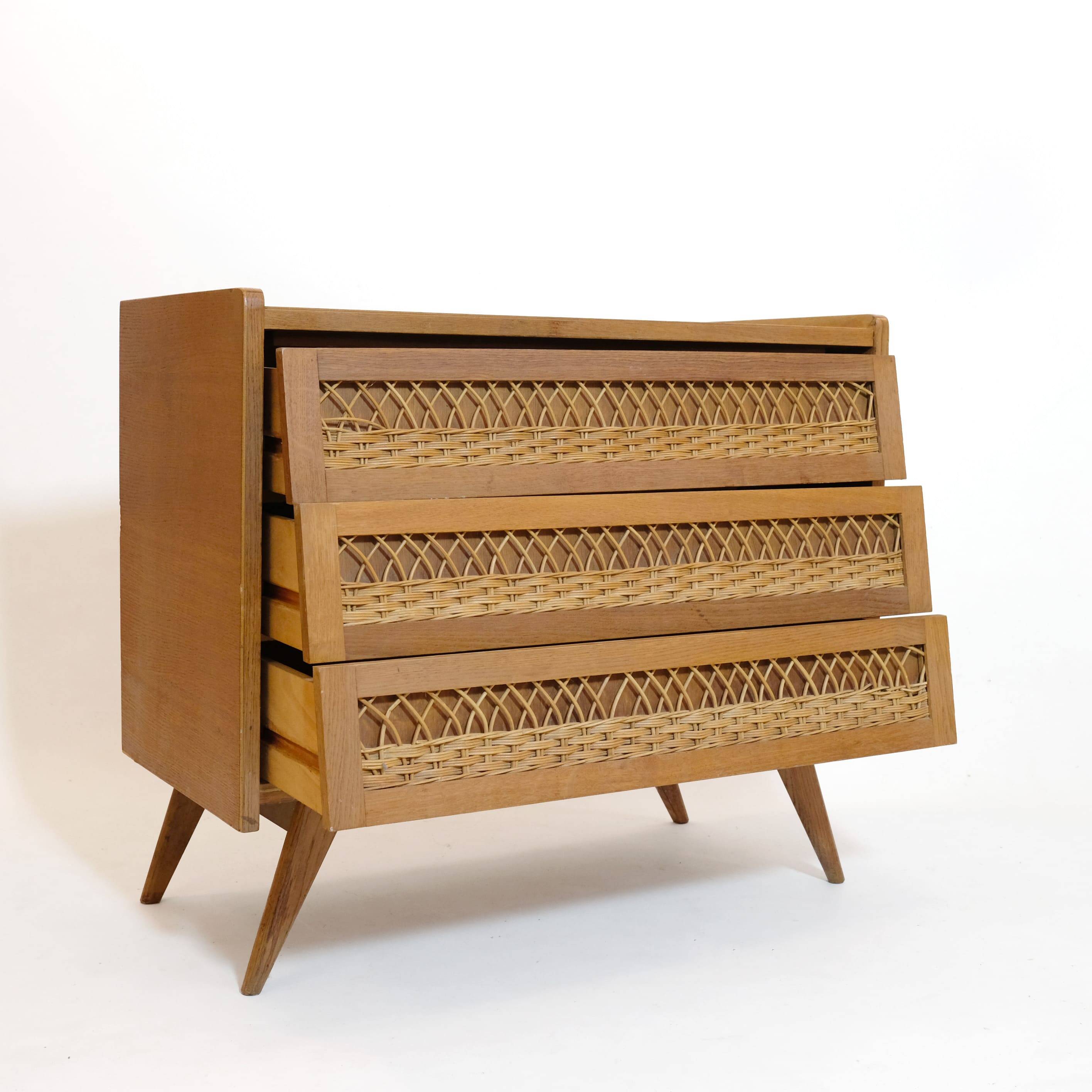 Wooden and rattan chest of drawers from the 60s.
