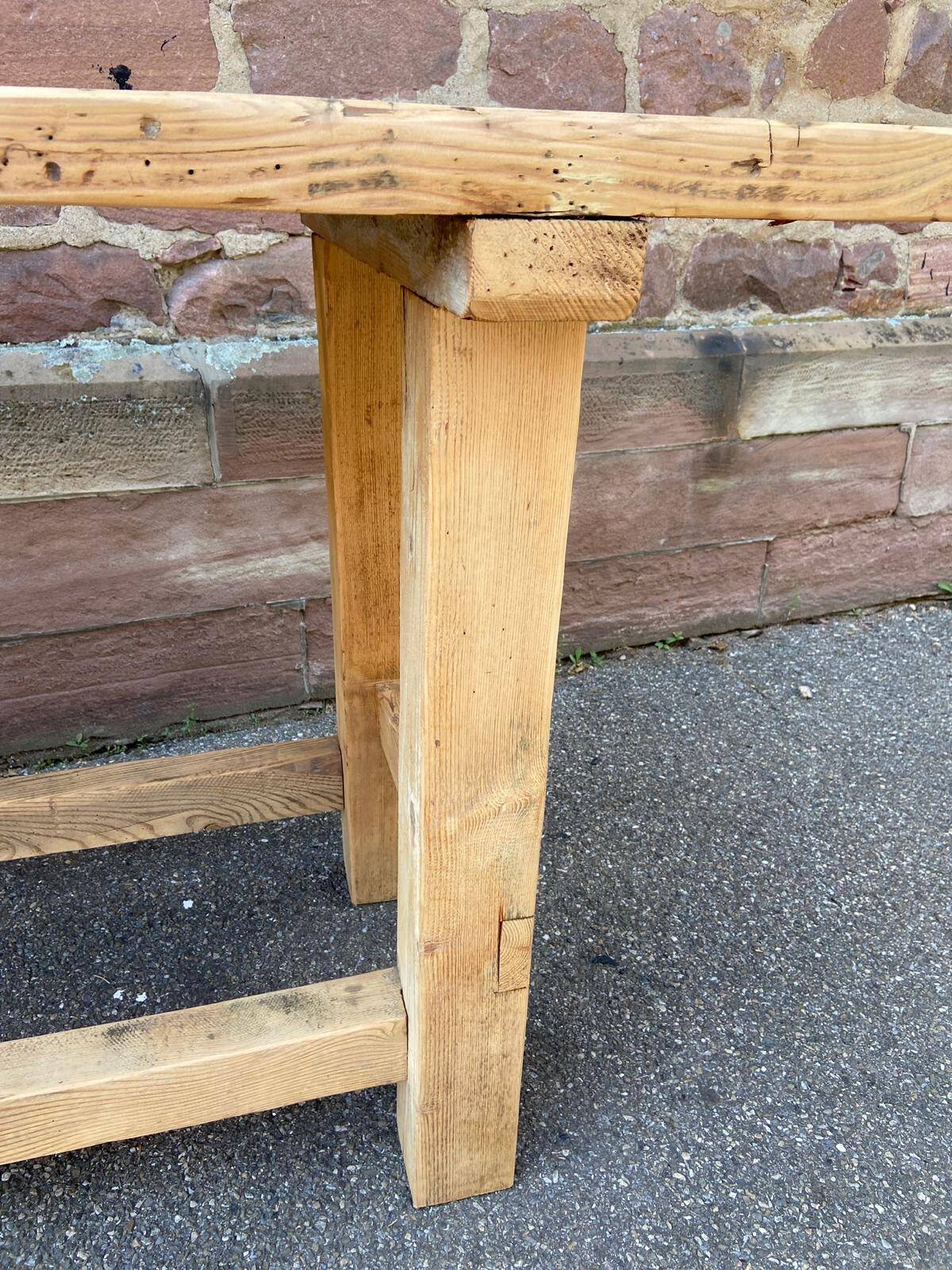 Primitive industrial table workbench in raw natural wood vintage bohemian trade store