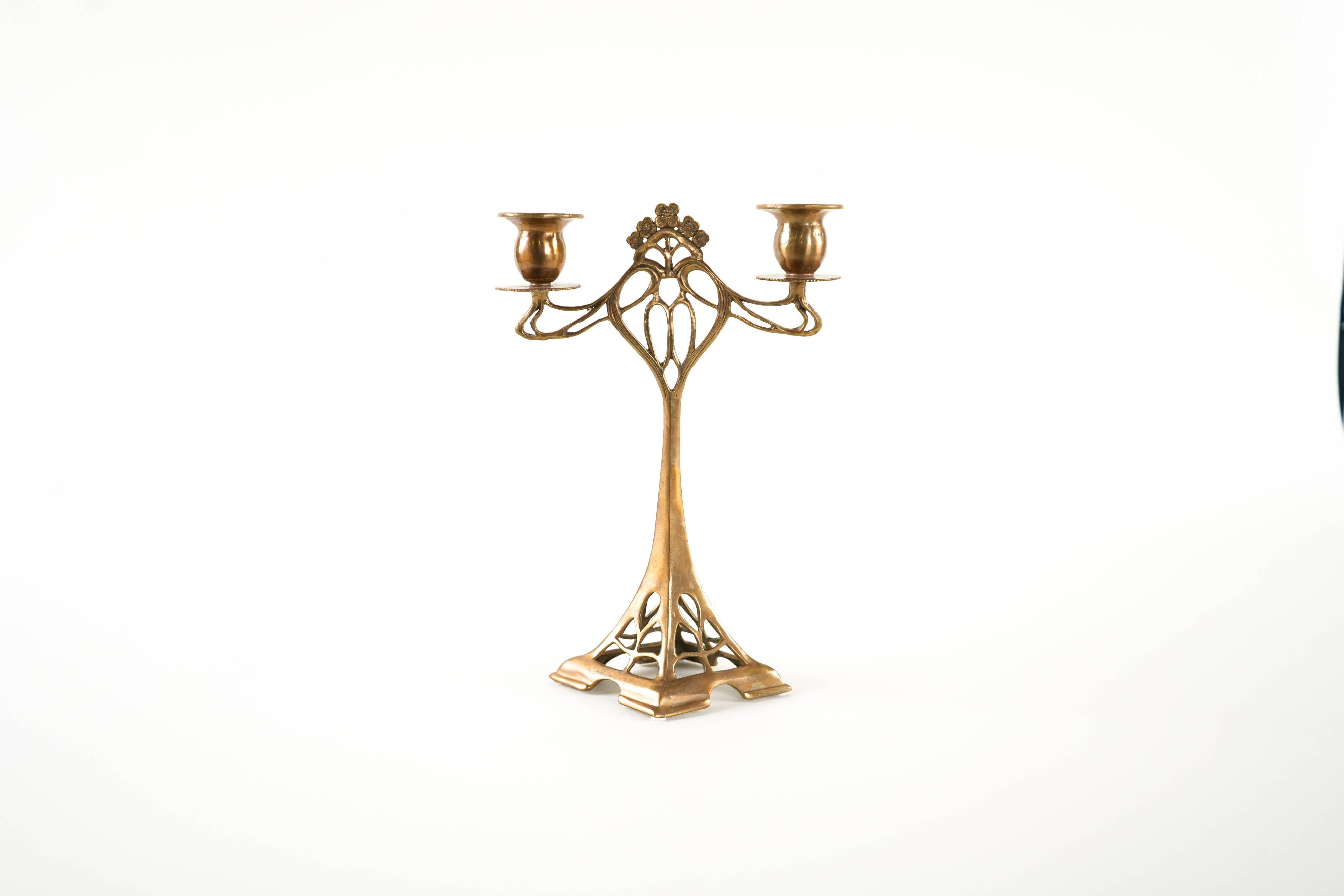 Art Nouveau brass candlestick with floral ornamentation, two arms, European