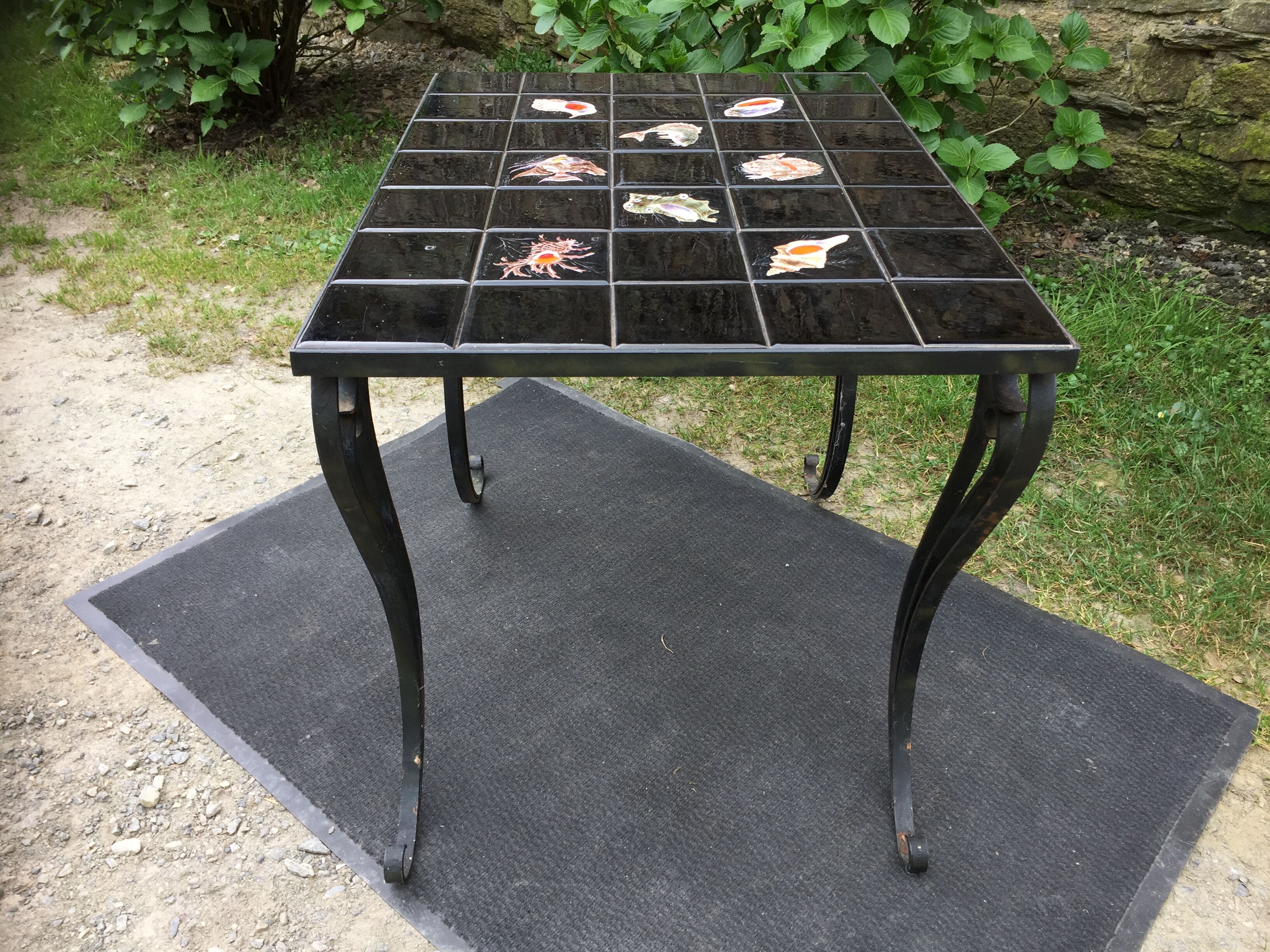 Vintage ceramic coffee table by Guy Trévoux with wrought iron base.