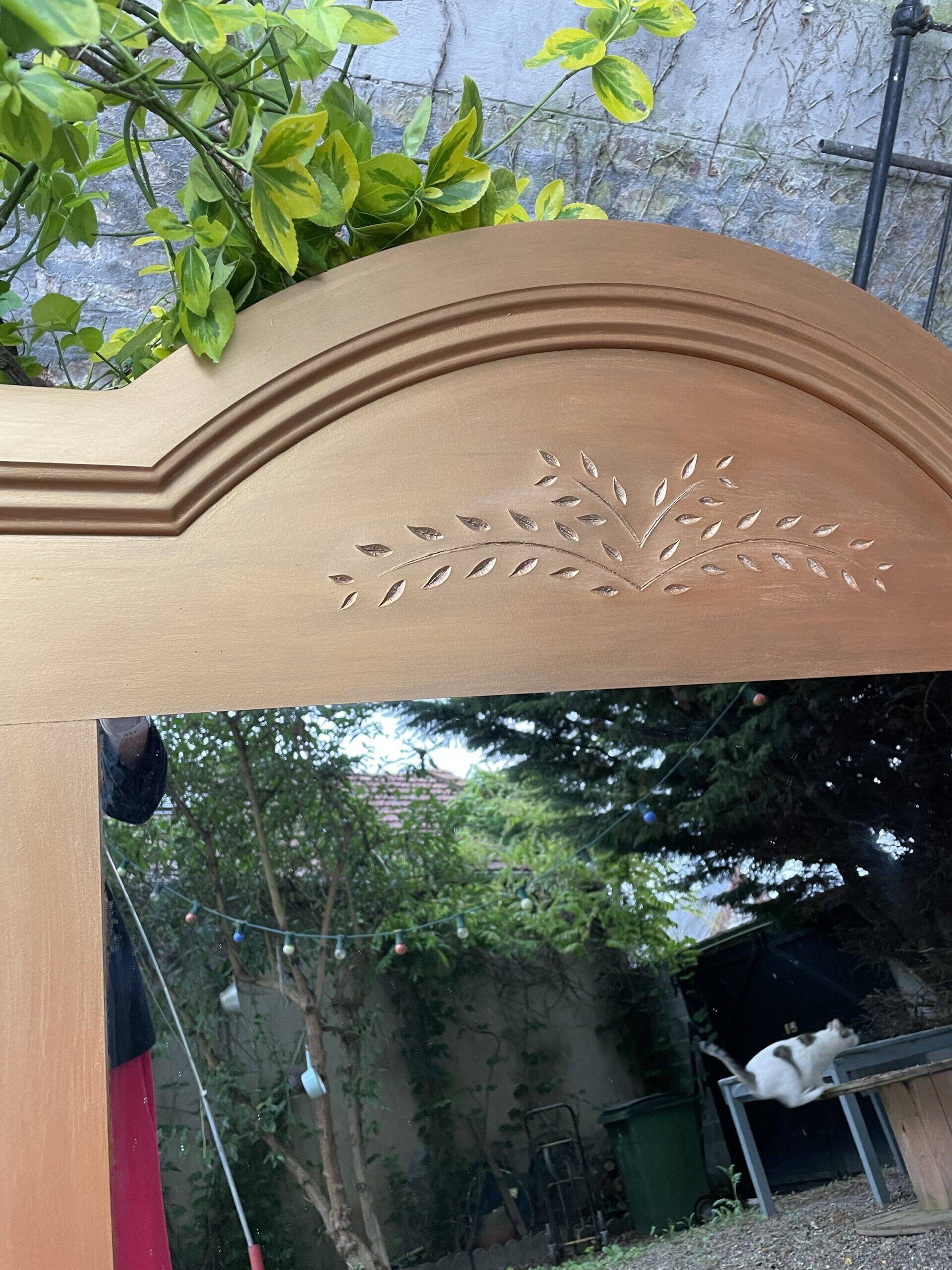 Golden mirror with wheat decoration