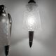Silver Art Deco wall lights with frosted glass.