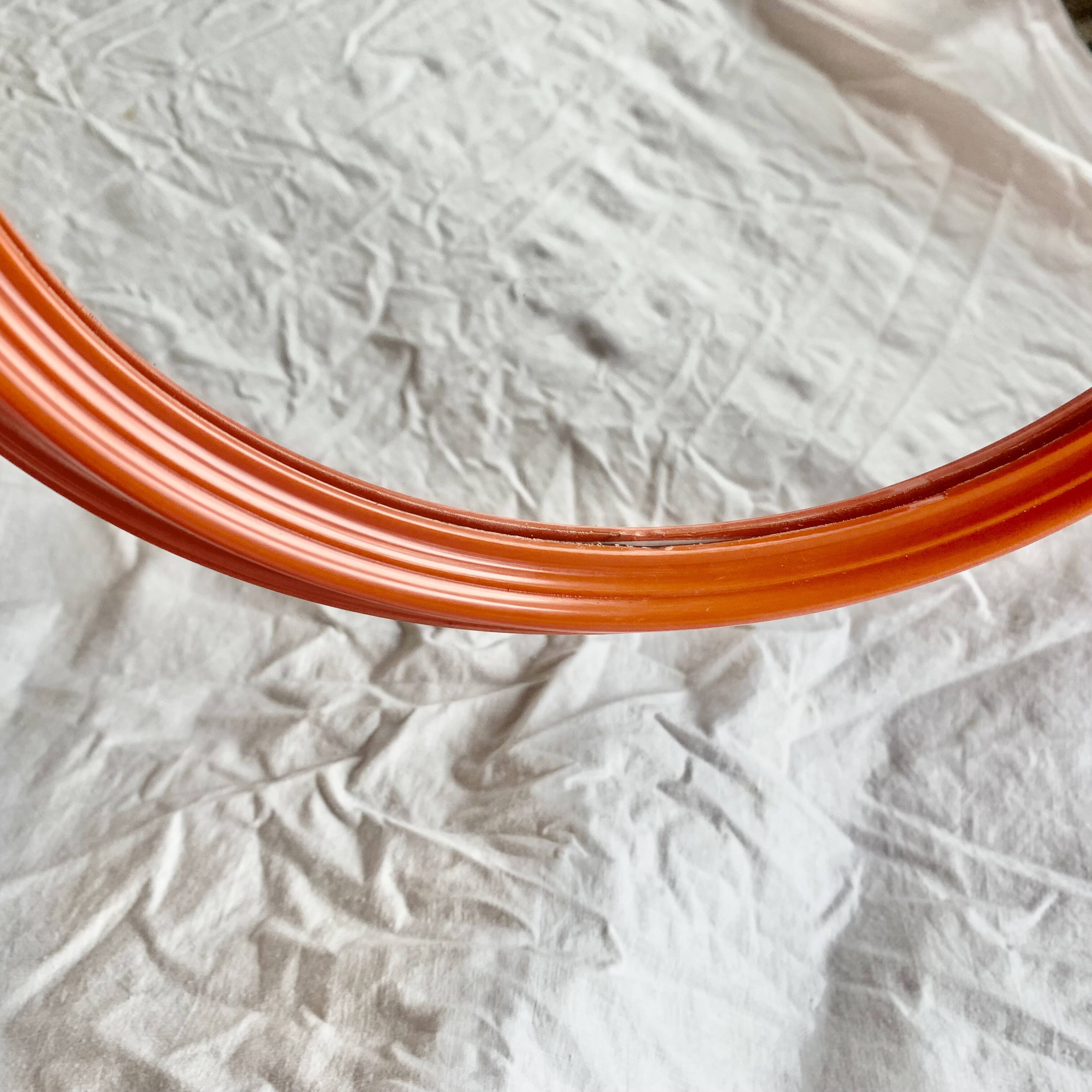 Vintage orange plastic oval wall mirror