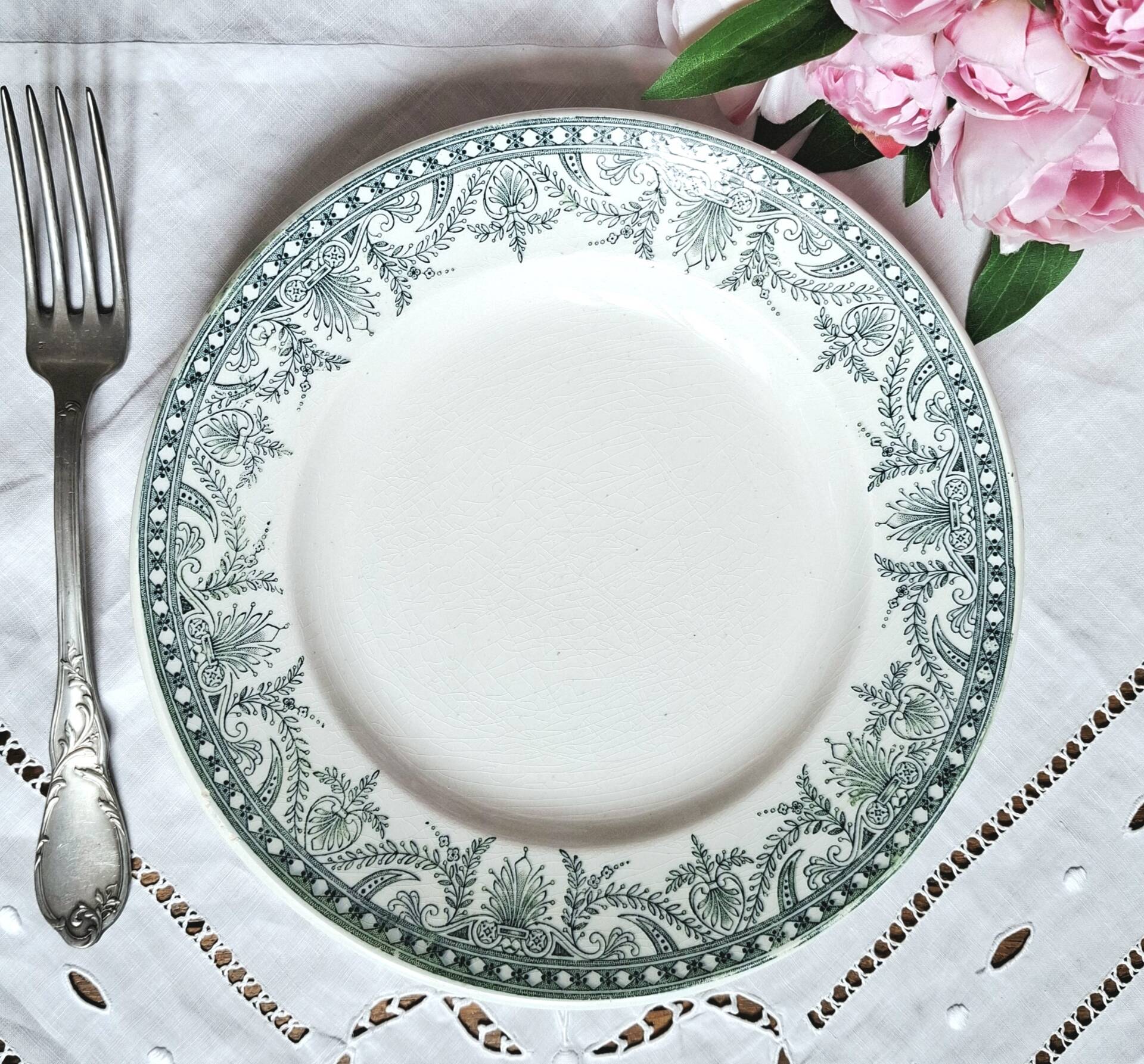 Old mismatched flat plates made of ironstone earthenware.