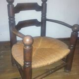 Low oak and straw armchair 1940
