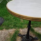 Antique bistro table with marble-decorated top