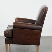 Characterful sheep leather armchair with a beautiful deep colour
