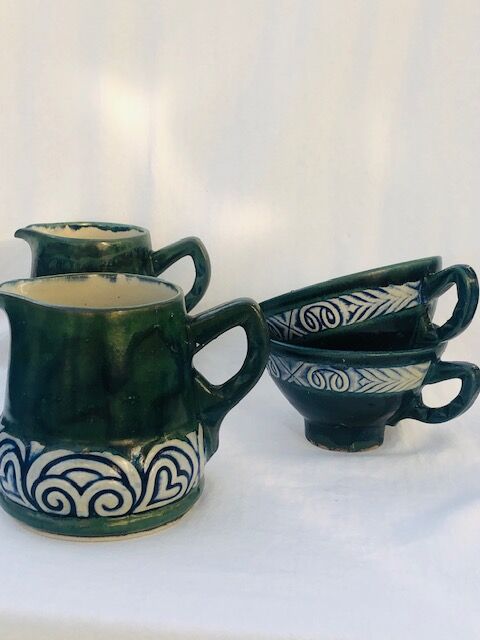 Two cups and two quimper milk jars