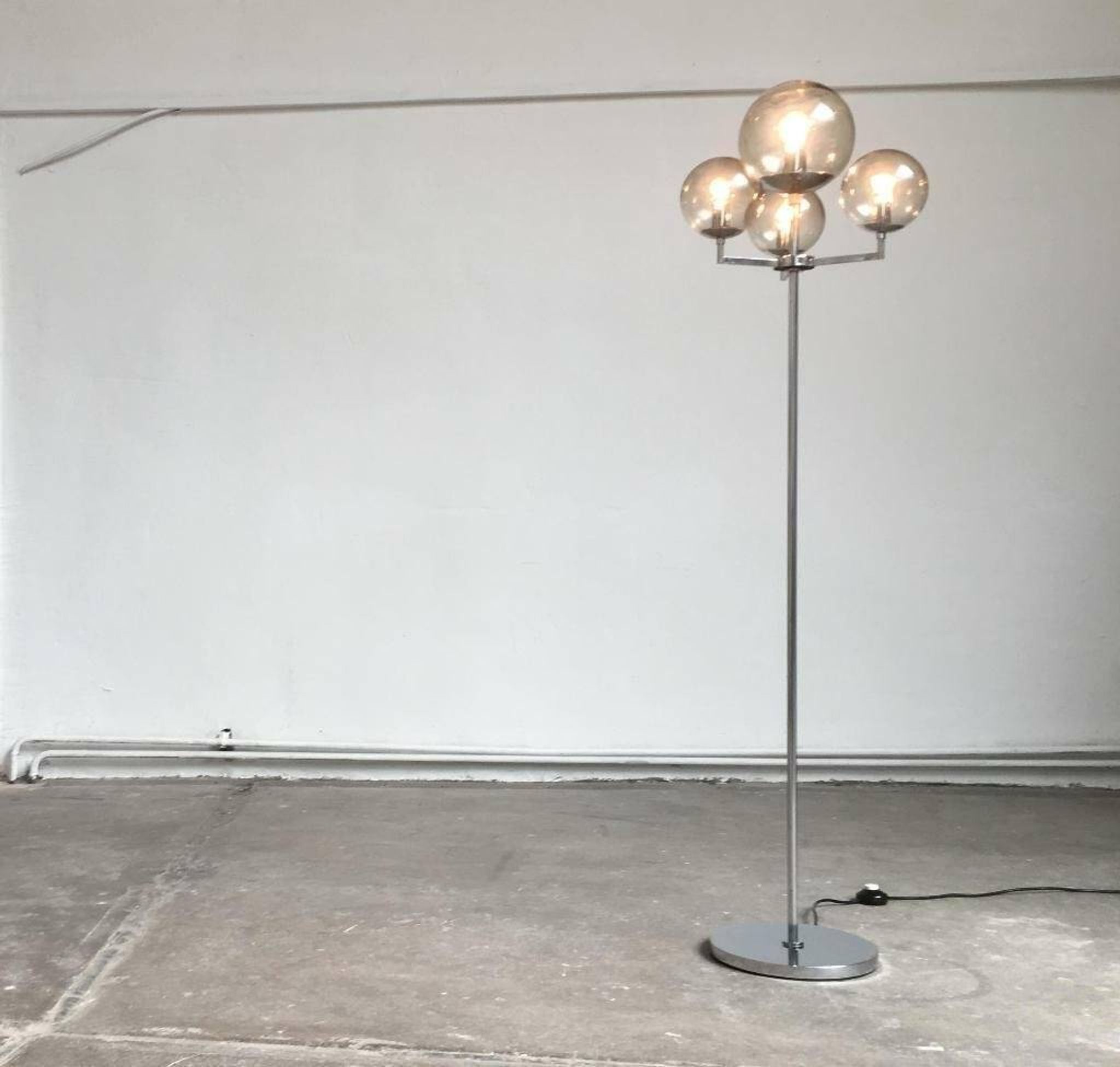 Chrome and glass floor lamp in mid-century German space style by Hustadt Leuchten, 1960s.